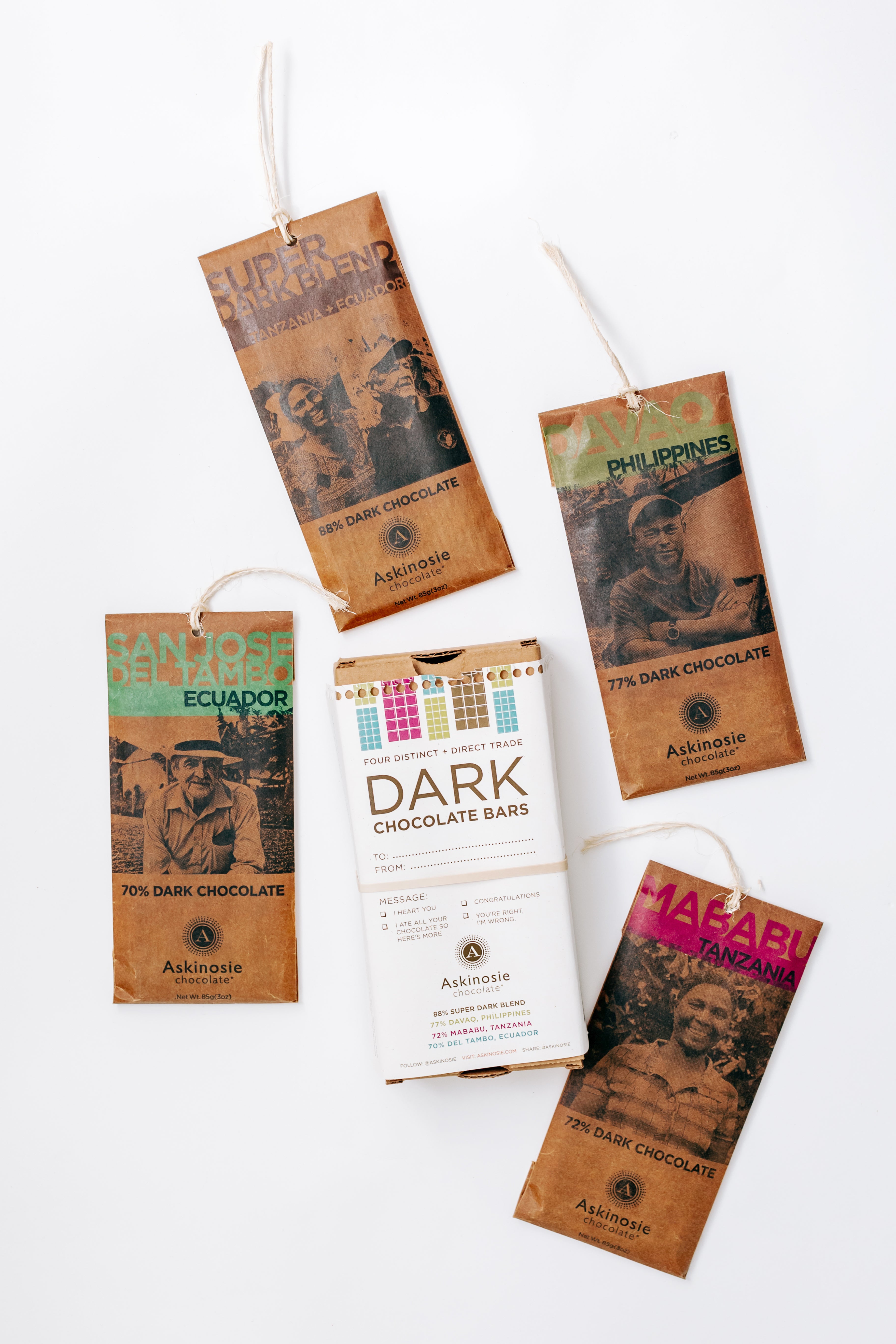 Askinosie Single Origin Dark Chocolate Four Bar Pack Gift Box Packaging with bars displayed on a white background