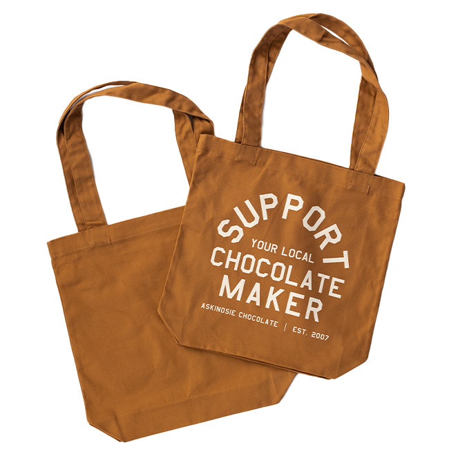 Tan Tote Bag with text "Support Your Local Chocolate Maker" in off-white ink color