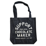 Denim tote back screen printed with "Support Your Local Chocolate Maker" in off white ink