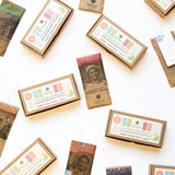 Scattered chocolate bars nearby packaged Build Your Own Chocolate Tasting Kit Boxes