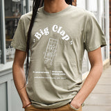 Model wearing a moss green t-shirt with "Big Clap" design